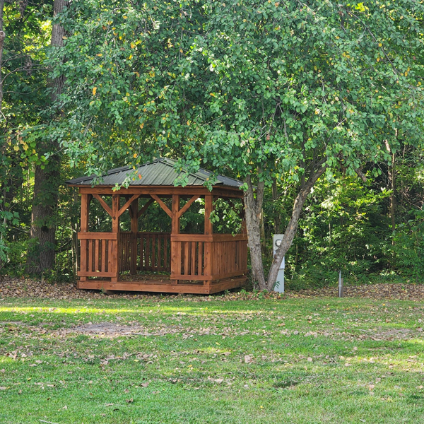 Wooden gazebo in the woods